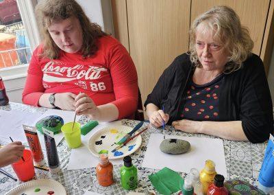 Two visitors painting